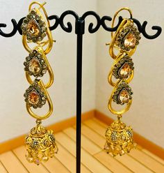 Beautiful bollywood indian pakistani gold pleated earring  Please keep in mind that the colour of the product shown in the pictures may vary from the original due to the lighting used. Wedding Jhumkas With Intricate Dangle Design, Wedding Dangle Jhumkas With Intricate Design, Gold Dangle Jhumkas For Wedding, Traditional Drop Clip-on Earrings For Party, Gold Latkan Earrings For Wedding, Gold Chandbali Danglers, Heavy Gold Earrings For Festive Occasion, Gold Latkans Earrings For Wedding, Gold Earrings With Latkans For Wedding