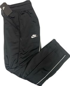 Black Athleisure Bottoms For Training, Black Go-dry Athleisure Bottoms, Black Activewear With Elastic Waistband For Sports, Black Stretch Sweatpants Sporty Style, Black Sporty Stretch Sweatpants, Black Stretch Sporty Sweatpants, Nike Sportswear Tracksuit For Sports, Sporty Black Gym Bottoms, Black Sportswear Bottoms For Training