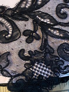 Black lace Alencon type. In very good condition. This lace is being offered by the yard. Black Lace With Lace Closure For Evening, Scalloped Stretch Lace For Party, Party Black Lace With Contrast Detail, Stretch Lace With Lace Patchwork For Party, Black Lace With Patchwork For Evening, Fitted Black Lace With Lace Trim, Elegant Black Crochet Lace, Fitted Crochet Lace For Party, Black Scalloped Lace For Evening