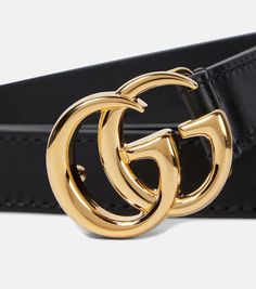 Gucci’s famed GG logo may be decade-old but it’s in accessories like this belt that its timeless allure really shines through – and quite literally so. Made from gleaming gold-toned brass, it’s one of fashion's most coveted and instantly recognizable symbols. Here, it brings unabashed refinement to the overall pared-back black leather profile..Color of fastening: gold.Made in Italy.Material: cow leather.Width 2cm-1'.Buckle width 3cm-1' Classic Black Belt With Logo, Gold Leather Belt Buckle With Logo Plaque, Modern Formal Belt Buckles With Logo, Modern Gucci Leather Belt Buckles, Classic Formal Belt Buckles With Logo, Elegant Leather Belt With Logo, Gold Belt With Logo Plaque For Formal Occasions, Elegant Black Gucci Belt Buckles, Designer Formal Belt Buckles With Metal Logo