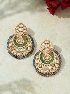 Indulge in the opulent allure of our designer Chand Baali earrings, meticulously crafted with intricate fancy polkis complemented by a palette of mesmerizing agate beads. Perfectly suited for the grandeur of festive celebrations, weddings, and chic soirées, these earrings seamlessly blend with both traditional Indian attire and contemporary fusion ensembles. Each piece embodies the essence of luxury, crafted with authentic semi-precious stones for an unmistakably regal touch. Finish: 22KT Gold P Chandbali Cutdana Jhumkas For Designer Wear, Chandbali Jhumkas For Designer Wear, Chandbali Jhumkas With Cutdana For Designer Wear, Elegant Chandbalis With Cutdana For Designer Wear, Bollywood Cutdana Earrings For Designer Wear, Elegant Chandbalis For Festivals, Bollywood Designer Cutdana Earrings, Bollywood Style Designer Earrings With Cutdana, Bollywood Style Chandbali Earrings For Designer Wear