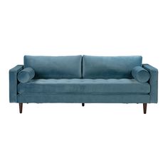 a blue couch sitting on top of a white floor