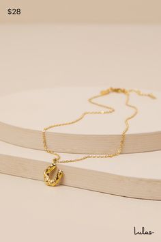 Let everyone know you're the cutest cowgirl around with the Petit Moments Horse Shoe Gold Charm Necklace! Shiny, gold-toned metal shapes this darling necklace composed of an ultra-slender chain that supports an adorable horseshoe charm with a wavy, textured design across the surface, for a vintage-inspired effect. Chain Measures 16" Long With a 2" Extender Chain. Lobster clasp closure. 100% Stainless Steel. Imported. Lulus | Horse Shoe Gold Charm Necklace. Gold Horseshoe Jewelry With Adjustable Chain, Everyday Gold Horseshoe Necklace, Elegant Horseshoe Necklace For Everyday, Horseshoe Necklace With Adjustable Chain As Gift, Gold Horseshoe Charm Necklace As Gift, Gold Horseshoe Charm Necklaces As Gift, Adjustable Gold Horseshoe Jewelry, Horseshoe Necklace With Adjustable Chain For Gift, Gold Horseshoe Necklace With Adjustable Chain