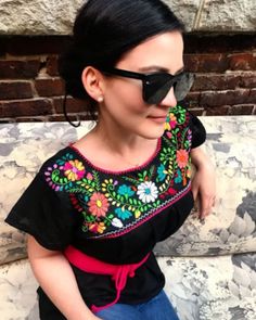 These stunning, vibrant Mexican blouses are meticulously handcrafted by skilled artisans in Oaxaca, a state steeped in rich tradition. With their short sleeves, chic o-neckline, and exquisite mix of medium and  petite floral motifs, these blouses exude effortless coolness. Each blouse is made from a blend of fresh Mexican cotton, adorned with captivating embroidery in a kaleidoscope of colors. Whether you're going about your daily routine, attending work, enjoying a shopping spree, or lounging b Traditional Blouses, Mexican Blouses, Embroidery Traditional, Mexican Embroidery, Mexican Blouse, Womens Blouses, Mexican Style, Work Looks, Beautiful Blouses