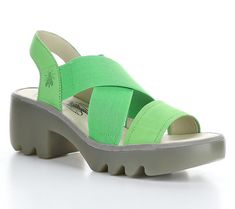 Add carefree style to your steps with these stretchy sandals featuring sturdy rubber soles and an airy open design. From Fly London. Green Sandals With Arch Support For Spring, Green Casual Slingback Sandals For Beach, Green Synthetic Sport Sandals For Summer, Green Sandals With Textured Sole For Spring, Green Sandals With Ortholite Insole, Modern Green Sandals With Removable Insole, Modern Slingback Sandals With Arch Support For Beach, Comfortable Green Sport Sandals For Spring, Modern Green Sport Sandals For Summer