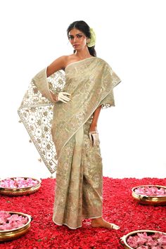 Designed to stand out from the crowd, this one-of-a-kind creation in Sage Green is a luxurious choice crafted with fine Gota Patti hand work on exquisite Organza silk. An exclusive piece, it radiates timeless elegance and looks stunning in any setting. Designer Saree With Dupatta For Reception, Silk Traditional Wear With Cutdana Detailing For Reception, Silk Traditional Wear With Cutdana For Reception, Silk Sets With Zari Weaving For Reception, Elegant Tussar Silk Traditional Wear For Reception, Silk Traditional Wear With Zari Weaving For Reception, Reception Traditional Wear With Zari Weaving In Tissue Silk, Designer Saree With Cutdana For Reception, Designer Cutdana Saree For Reception