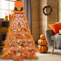 a decorated christmas tree in the middle of a living room with pumpkins and other decorations