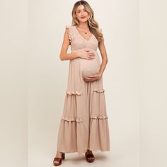 A Solid Hued Maternity Maxi Dress Featuring A V-Neckline, Ruffle Shoulder, Smocked Bodice And An A-Line Skirt With Ruffle Trim On The Sides. Vanilla Bay By Pinkblush New Without Tags Inventory #R73 Maternity V-neck Ruched Dress, Maternity V-neck Dress With Ruched Details, V-neck Ruched Maternity Dress, Beige Ruched V-neck Maxi Dress, Summer Flowy Maternity Dress With Smocked Back, Summer Maternity Dress With Smocked Bodice, Chic Flowy V-neck Maternity Dress, Spring Maternity Wear Ruched Dresses, Spring Maternity Dress With Ruched Details