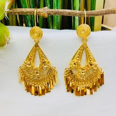 Beautiful and stunning handmade Mexican Filigree Earrings. Each piece is meticulously created out of copper wire and spun into a beautiful design. To give it the final touch artisans dipped into gold plate for it's gold color. This accessory is an important part of the traditional Tehuana outfit from Oaxaca, Mexico. Look elegant while wearing Mexico's culture with this one of a kind earrings! Approximate length: 3-3.5 in Need more than one? Ask us about our combined flat rate shipments for multi Ceremonial Latkans Earrings, Ceremonial Drop Earrings, Festival Filigree Drop Earrings Danglers, Filigree Drop Earrings For Festivals, Traditional Gold Teardrop Plug Earrings, Ceremonial Dangle Earrings, Ceremonial Round Earrings With Latkans, Traditional Gold Flower Earrings For Festivals, Ceremonial Pierced Drop Earrings