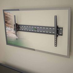 a flat screen tv mounted to the side of a wall