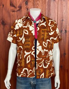 FAST SHIPPING WITH UPS. Tracking number will be sent to you. Description: Beautiful Vintage 60s Hawaiian shirt 100% cotton. Made in Hawaii. Condition. Very Good. Marked size: Medium, but please always refer to measurements. A: pit to pit : 55 cm B: length from back neck seam to bottom back hem: 71cm C: Length from neck seam to sleeve hem: cm D: length from shoulder seam to shoulder seam: 45cm *See last picture for details. *Please view all Detailed Pictures of the item up for offer for exact con Brown Cotton Camp Shirt With Camp Collar, Brown Cotton Hawaiian Shirt With Short Sleeves, Cotton Retro Shirt With Retro Print, Cotton Shirt With Retro Print, Brown Cotton Camp Collar Top, Brown Cotton Top With Camp Collar, Fitted Collared Hawaiian Shirt In Cotton, Fitted Cotton Collared Hawaiian Shirt, Cotton Camp Shirt With Retro Print