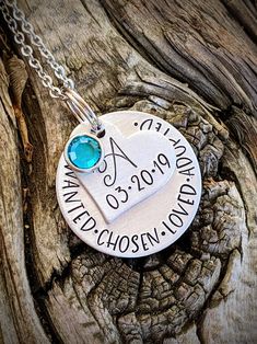 "Personalized hand stamped adoption necklace. Gift for adoption day. Gift for new daughter. Adopted daughter gifts. Adoption day jewelry. Custom adoption gifts. Daughter gift. Blended family gifts. Hand stamped and made to order. Made from a 1\" aluminum disc. Stamped with, \"Wanted. Chosen. Loved. Adopted.\" with dots in between. A 3/4\" aluminum heart is stamped with the child's name and included is a sparkly Swarovski crystal birthstone. Please see last photo for birthstone chart. All items a Hand Stamped Jewelry For Birthday And Mother's Day, Hand-stamped Jewelry For Birthday And Mother's Day, Hand Stamped Jewelry For Father's Day, Hand Stamped Jewelry For Father's Day Personalized Gift, Birthday Jewelry For Mother's Day, Meaningful Hand Stamped Jewelry For Birthday, Meaningful Hand Stamped Jewelry For Birthday Gift, Valentine's Day Birthday Stamped Jewelry, Birthstone Chart