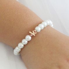 Personalized flower girl bracelet ,children's personalized pearl bracelet, flower girl gift , flower girl jewelry, wedding jewelry for kids. ♥Children's initial pearl bracelet on stretch cord. Available in ivory or white pearls and with a rhodium plated, 16k gold plated or rose gold plated lowercase initial. D E T A I L S ♥faux glass pearls 6mm ♥6mm rose gold plated, 16k gold plated or rhodium( silver) plated lowercase initial S I Z E ♥According to age ♥If you are unsure of the size please measu Personalized Adjustable Pearl Bracelet For Mother's Day, Personalized Adjustable Dainty Pearl Bracelet, Elegant Birthday Beaded Bracelets With Letter Beads, Elegant Personalized Rose Gold Beaded Bracelets, Elegant Personalized Rose Gold Beaded Bracelet, Elegant Pearl Bracelet With Letter Beads, White Dainty Pearl Bracelet For Birthday, Dainty White Pearl Bracelet For Birthday, Elegant White Name Bracelet For Mother's Day