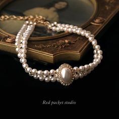 It is a perfect accessory for weddings, formal occasions, or any event where you want to make a statement. This sophisticated choker is designed to showcase your elegance and charm. Features: Material: Artificial pearls and alloy Chain style: Round pearl chain Length: 33cm + 11cm adjustable Weight: 38g Multi-layered with a pendant Pendant Material: Alloy Circumference: 21cm (inclusive) - 50cm (inclusive) With its vintage pearl design and delicate craftsmanship, this unique choker exudes a timele Luxury Vintage Necklace Collection, Luxury Antique Pearl Chain Necklaces, Luxury Victorian Chain Necklace As Gift, Luxury Temple Jewelry Wedding Choker, Luxury Victorian Antique Finish Necklace, Luxury Traditional Necklaces With Historical Design, Luxury Jewelry With Historical Baroque Design, Luxury Elegant Pearl Necklace For Layering, Luxury White Elegant Kundan Necklace