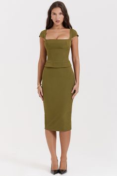 Details 
 Layana Olive Corset Midi Dress is incredibly chic. Cut from peached twill for a softly brushed texture, it features a corseted bodice to cinch the waist and is topped with a flattering square neckline and dainty cap sleeves.

We love how the fitted skirt falls to a classy long midi length as it skims over your curves and has a split to the back for easy movement. 'Layana' is fully lined for comfort and zips up the back for easy on. 
 Size Chart
             BUST WAIST HIP LENGTH   XS 8 เสื้อ�ผ้า Kylie Jenner, Corset Midi Dress, Bodycon Midi Skirt, French Dress, Office Dresses For Women, Square Neck Top, Mid Length Skirts, Fall Skirts, Sleeveless Crop Top