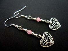 This a pair of pretty tibetan silver dangly heart earrings. Made with 4mm pink jade beads. Measure approx. 4cm from top of hook to bottom of earring. Freshly made by me and unworn. Thanks for looking!! Sterling Silver Heart Beads Dangle Jewelry, Valentine's Day Beaded Metal Jewelry, Dainty Metal Earrings For Valentine's Day, Handmade Metal Jewelry For Valentine's Day, Silver Heart Beads Metal Earrings, Heart Beads Metal Earrings For Gift, Metal Heart Beads Earrings For Gifts, Silver Heart Beads Dangle Jewelry, Metal Heart Beaded Earrings For Gifts