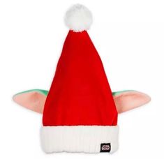 a red and white santa hat with horns