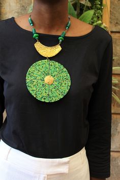 Handmade in Nairobi , Kenya! Crafted with brass and green and gold seed beads. SHIPPING Express shipping (via DHL) takes 2-5 WORKING DAYS to be delivered to you. Green Necklaces With Gold Beads For Jewelry Making, Green Necklace With Gold Beads As Gift, Green Beaded Chain Pendant Necklace, Green Necklace With Gold Beads For Gift, Green Pendant Necklace With Beaded Chain, Green Necklaces With Gold Beads For Gift, Green Necklaces With Gold Beads, Green Bib Necklace With Round Beads For Gift, Green Round Beads Bib Necklace As Gift