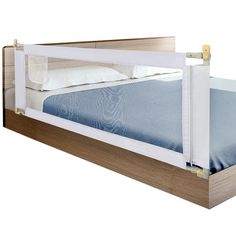 the bed frame is made from wood and has a blue sheet on top of it