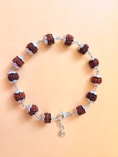 "Giglirigli Gems" Welcomes you "Valuable Rudraksha Bracelet, Gemstone Bracelet, Brown Statement Bracelet, 925 Sterling Silver Jewelry, Anniversary Gift, Bracelet For Wife" Metal : 925 Sterling Silver Pearl Pendants https://www.etsy.com/shop/Giglirigligems?ref=seller-platform-mcnav&search_query=Pearl+pendants Pearl Earrings https://www.etsy.com/shop/Giglirigligems?ref=seller-platform-mcnav&search_query=Pearl+earrings Pearl Ring https://www.etsy.com/shop/Giglirigligems?ref=seller-platform-mcnav&search_query=Pearl+ring A complete hub of Silver/Gold Jewelry & Gemstone Manufacturing Our Ability - 1000 Pieces per week &CAD/CAM Designing,Wire Wrapped Jewelry ,Rhodium Plating ,Micron plating,Grain Setting etc We are any Design as per your Requirement Payment policy We accept the payment via paypal Adjustable Sterling Silver Beaded Fusion Bracelets, Handmade Beaded Bracelets In Sterling Silver With Fusion Style, Spiritual Sterling Silver Bracelets With Silver Clasp, Adjustable Silver Bracelets For Festivals, Nickel-free Sterling Silver Rosary Bracelet, Adjustable Silver Spiritual Bracelets, Silver Adjustable Spiritual Bracelets, Adjustable Silver Spiritual Bracelet, Spiritual Sterling Silver Beaded Bracelets