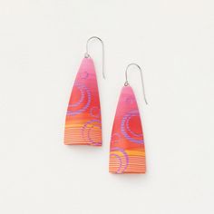 two pairs of earrings with pink and orange designs on the front, one is shaped like an earring