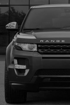 a range rover parked in front of a building