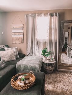 a living room filled with furniture and a mirror