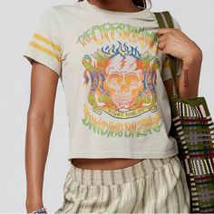 The Offspring Tee With A Psychedelic Graphic Printed At The Front. Hits At The Waist And Slim-Fitting Throughout With A Crew Neckline. Complete With Striped Detailing At The Sleeves. Urban Outfitters Exclusive. Features - The Offspring Graphic Tee - Striped Sleeves - Slim-Fit - Uo Exclusive Content + Care - 100% Cotton - Machine Wash - Imported Size + Fit Women’s Size Large Urban Outfitters Relaxed Fit T-shirt For Spring, Spring Festival Hippie T-shirt, Spring Festival Casual T-shirt, Trendy Graphic Print Tops For Music Festival, Green Cotton T-shirt By Urban Outfitters, Summer Streetwear Tops With Vintage Print, Urban Outfitters Green Cotton T-shirt, Vintage Print Tops For Summer Streetwear, Fitted Vintage Print T-shirt For Spring