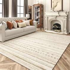 a living room filled with furniture and a fire place in front of a white fireplace