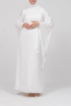 Front view of the ivory satin kimono sleeve Nikah maxi dress Elegant White Wedding Dress For Ceremony, White Satin Dress For Banquet, Floor-length Satin Gown For Ceremonies, White Satin Maxi Dress For Formal Occasions, Elegant White Satin Silk Dress, Elegant White Satin Maxi Dress, White Satin Floor-length Dress, Floor-length Satin Dresses For Ceremony, White Silk Satin Evening Dress