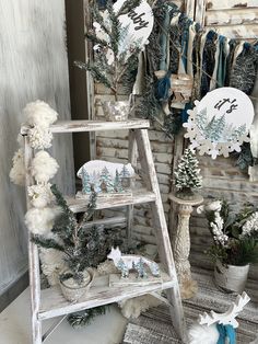 an old ladder decorated with snowflakes and christmas decorations