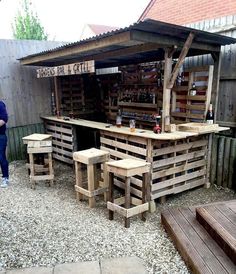 an outdoor bar made out of wooden pallets