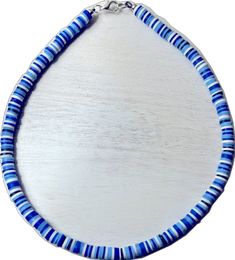 Handmade Blue Strand Jewelry, Blue Hand-strung Necklaces For Beach, Blue Hand-strung Necklace For Beach, Hand-strung Blue Necklaces For The Beach, Blue Letter Beads For Gifts, Blue Hand-strung Heishi Beads, Adjustable Blue Beaded Necklace For Vacation, Adjustable Blue Necklace For Vacation, Blue Heishi Letter Beads