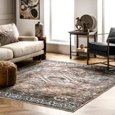 a living room filled with furniture and a rug