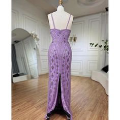 a purple dress is on display in a room