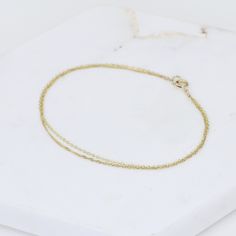 "14K Gold Dainty Double Chain Bracelet - 14K Solid Gold Bracelet ★ The chains and all components are 14K solid yellow gold The length includes the chain and the closure. Please measure your wrist before you place your order. ** How to choose a correct size of bracelet. 1. Measure your wrist below the wrist bone using a flexible tape measures, a string or a strip of paper. 2. If using a string or a strip of paper, mark length. Then, measure it with a ruler. 3. To find the bracelet size, add 1/2\" 14k Yellow Gold Bracelet With Cable Chain, Delicate Chain Yellow Gold-plated Bracelet, Yellow Gold-plated Bracelet With Delicate Chain, Delicate Yellow Gold-plated Chain Bracelet, Gift Yellow Gold Chain Bracelet With Cable Chain, Yellow Gold Cable Chain Bracelet As Gift, Gift Yellow Gold Cable Chain Bracelet, Yellow Gold Recycled Gold Bracelet As A Gift, Yellow Gold Recycled Gold Bracelet For Gift