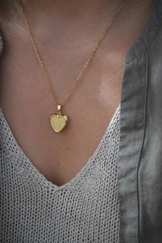 18-karat gold plated heart locket hangs on a sturdy 18-karat gold plated stainless steel chain.  Choose your chain length from the drop-down menu.   This locket is perfect for using as a keepsake necklace and is a thoughtful gift for someone special in your life. You can choose the locket as is, without photos, or have it personalized with your photo (s) and engraved your birth flower. You choose your options at checkout.  A mock-up of the photo will be done for your approval. Once approved, I w Gold Plated Jewelry For Valentine's Day Anniversary, Gold Plated Gold Locket Pendant Necklace, Gold-plated Gold Locket Necklace Pendant, Gold Plated Pendant Locket Necklace, Gold-plated Pendant Locket Necklace, Gold-tone Pendant Locket Necklace, Gold-tone Gold Plated Pendant Locket Necklace, Valentine's Day Engraved Gold Plated Jewelry, Valentine's Day Anniversary Gift Gold Plated Jewelry