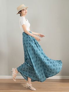 "Elevate your summer wardrobe with this gorgeous light blue polka dot skirt. The elegant midi length and the feminine polka dots create a lovely vintage vibe that will make you feel like a 1950s movie star.The flowy silhouette and the cute polka dots make it a perfect choice for a picnic or a stroll in the park. DETAIL * Tencel blend * High waisted skirt * Two side pockets * Polka dot detail * Plus size skirt * Circle skirt * Perfect summer spring skirt * Dry clean * The model is 168cm (5′ 6″) t Light Blue Skirt For Vacation, Casual Light Blue Long Maxi Skirt, Casual Light Blue Midi Skirt, Polka Dot Long Skirt For Spring, Casual Light Blue Lined Maxi Skirt, Light Blue Casual Midi Skirt, Spring Polka Dot Long Skirt, Polka Dot Lined Summer Skirt, Light Blue Skirt With Pockets