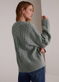 A cable-knit sweater with just enough slouch. Knit from a soft blend of cashmere and merino wool, the oversized styling makes for the perfect French tuck in your favorite jeans or pair it with leggings for the easiest outfit ever.Complimentary cashmere comb included. While supplies last. 57% Wool 25% Cashmere 18% NylonAdrianna is 5'9" wearing size Extra-Small Cable Knit V-neck Sweater For Layering, Oversized Cozy Cable Knit V-neck Sweater, Cozy Gray Cable Knit Sweater, Oversized Cable Knit Cashmere Sweater, Oversized Cashmere Cable Knit Sweater, French Tuck, Cable Sweater, Ivory Color, Favorite Jeans