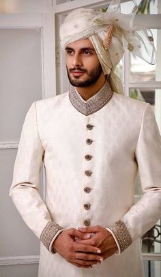 Classic Long Sleeve Traditional Formal Wear, Classic Formal Traditional Wear For Eid, Classic Unstitched Traditional Wear For Formal Occasions, Festive Long Sleeve Traditional Fit Sherwani, White Dabka Sherwani Traditional Fit, Traditional Fit Sherwani For Wedding And Diwali, Traditional Fit Bandhgala For Wedding, Classic Bandhgala For Eid Festivities, Classic Bandhgala For Eid Festival