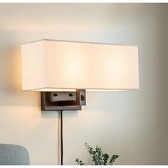 Add modern style to seating areas or bedrooms with this wall lamp. Easy to install, the fixture can be hardwired or plug-in, adding instant style and light to any setting. The wall sconce features an industrial modern profile with white linen shades. The wall plate and angle arm come in a oil-rubbed bronze metal finish. An on-off dimmer switch on the arm gives you easy lighting control. Industrial Modern, Bronze Metal, Home Decor Lights, Wall Light Fixtures, Linen Shades, Wall Plate, Dimmer Switch, Modern Industrial, Decor Lighting