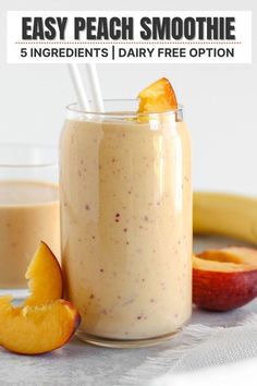 peach smoothie in a mason jar with strawberries and sliced peaches on the side