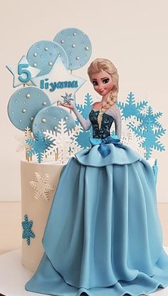 a frozen princess cake with snowflakes on it