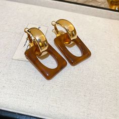 brown earrings Modern Brown Jewelry For Parties, Elegant Dangle Resin Earrings, Elegant Resin Dangle Earrings, Trendy Brown Rectangular Jewelry, Chic Brown Formal Jewelry, Elegant Brown Earrings For Party, Chic Brown Dangle Jewelry, Chic Brown Earrings For Party, Brown Rectangular Metal Jewelry