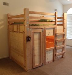 a wooden bunk bed sitting in a bedroom next to a window