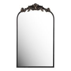 a large mirror with an ornate frame on the top and bottom edge, in black