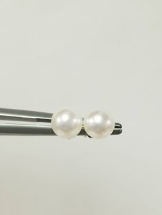 "Thanks for shopping our vintage estate store. We tend to sell well below wholesale and truly hope you enjoy all of our items. Many of the items are one of a kind, so please enjoy scrolling through the pictures and hopefully something will catch your eye. Brown spots are from camera. Nice estate 14k white gold natural pearl studs. Freshwater cultured pearls, custom made for our store. Size: 6mm 1/4\" Weight: .93 gram Earring backs are included. Freshwater pearls takes 4 to 6 years to be develope Classic Hallmarked White Gold Earrings, Classic White Pearl Earrings, Classic White Round Cut Pearl Earrings, Timeless Round Pearl Earrings For Anniversary, Classic Nickel-free Earrings With Round Beads, Classic Nickel-free Round Bead Earrings, Timeless Sterling Silver Pearl Earrings For Anniversary, Classic White 14k Gold Earrings, Classic White Jewelry For Gift