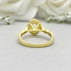 This beautiful ring is made from genuine 925 sterling silver with yellow gold plating. Engagement Ring details- -The Main stone is an oval cut 8mm by 6mm Simulated Diamond -Side stones are Round 1.3mm and 1mm simulated diamonds -Ring is casted in solid 925 sterling silver with yellow gold plating ( Rose gold and rhodium plated also available, please check the drop down menu for more options) -The Total face height of the ring measures 10mms and the band width measures 2mms -Each ring is handmade Gold Cubic Zirconia Cluster Ring With Halo Design, Gold Diamond Ring With Oval Cabochon Gemstone, Yellow Gold Oval Halo Ring With Cubic Zirconia, Oval Yellow Gold Halo Ring With Cubic Zirconia, Gold Oval Cabochon Diamond Ring With Gemstone, Gold Opal Ring With Halo Design - Gift, Oval Cluster Ring In Yellow Gold With Cubic Zirconia, Oval Cubic Zirconia Cluster Ring In Yellow Gold, Oval Yellow Gold Cubic Zirconia Cluster Ring