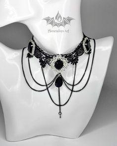 Nocturnal Gothic Victorian Royal Black Lace Necklace with Black and White Rhinestones by Plamendura Art Welcome to this listing! We are glad that you are here. This necklace is perfect as a gift for her or as a jewelry for different occasions as festivals, proms, weddings, medieval or fantasy events. It can bring joy only even when you look at it. Every necklace is lovingly handmade by Plamendura Art. You can easily adjust the length of the chain as you like. ! Every product in this store is mad Formal Black Jeweled Necklaces, Gothic Black Jewelry For Formal Occasions, Black Jewel Necklace For Party, Black Jeweled Necklace For Evening, Gothic Chain Jewelry For Evenings, Victorian Style Black Jewelry For Party, Victorian Black Jewelry For Evening, Black Metal Necklaces For Wedding, Black Jeweled Necklace For Party