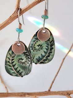 Fern, symbol of spiral , represents growth and new beginnings  1 "  long, comfortable to wear.   I  hand patina each one....  good  hypoallergenic ear wires  comes to you in a gift package shipped with tracking      FREE SHIPPING  FACEBOOK Moon Heart Studios INSTAGRAM JOANIESA3 Adjustable Hand Painted Nature-inspired Jewelry, Green Brass Earrings Nature-inspired, Green Copper Earrings For Gift, Earthy Soldered Earrings For Gift, Nature-inspired Electroformed Brass Earrings, Green Electroformed Bohemian Jewelry, Green Bohemian Electroformed Jewelry, Green Hand-painted Bohemian Earrings, Bohemian Green Electroformed Jewelry